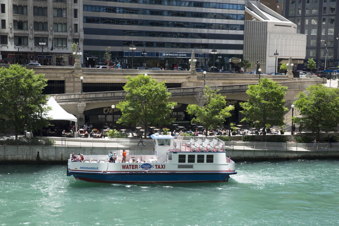 Shoreline Sightseeing water taxi cruising the Chicago River with the downtown skyline in the background